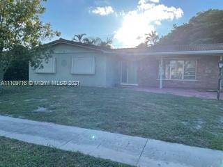 49 Southwest 9th Avenue Boca Raton, FL 33486 - Photo 6 of 8 a view of a house with a yard