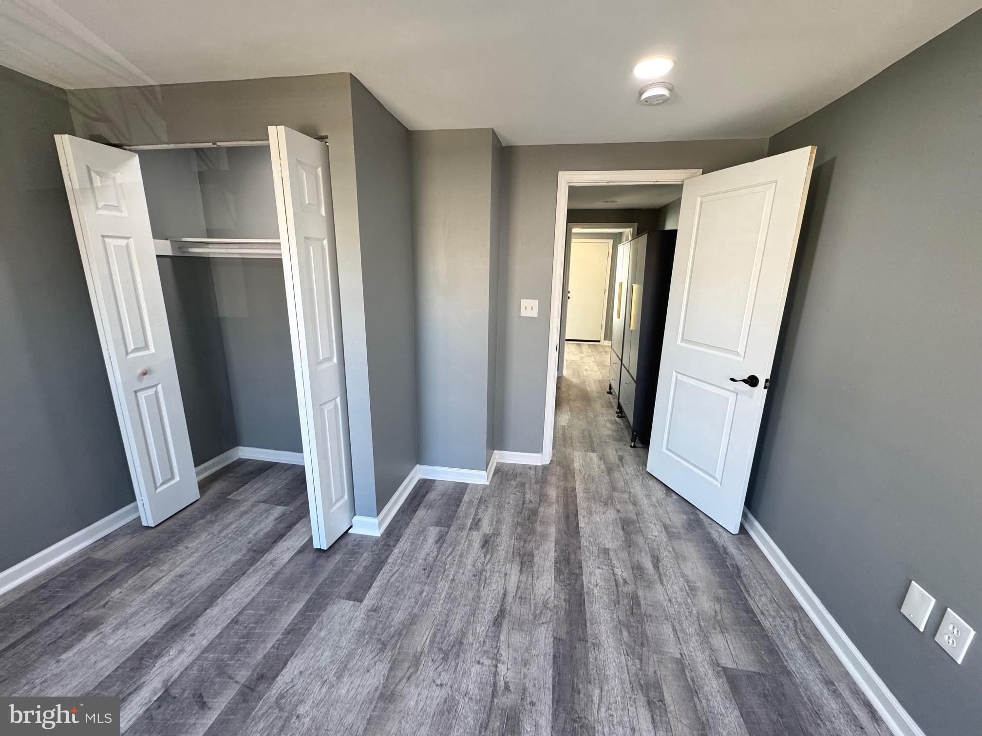 764 Morton Street Northwest Washington, DC 20010 - Photo 15 of 23 an empty room with wooden floor and entrance