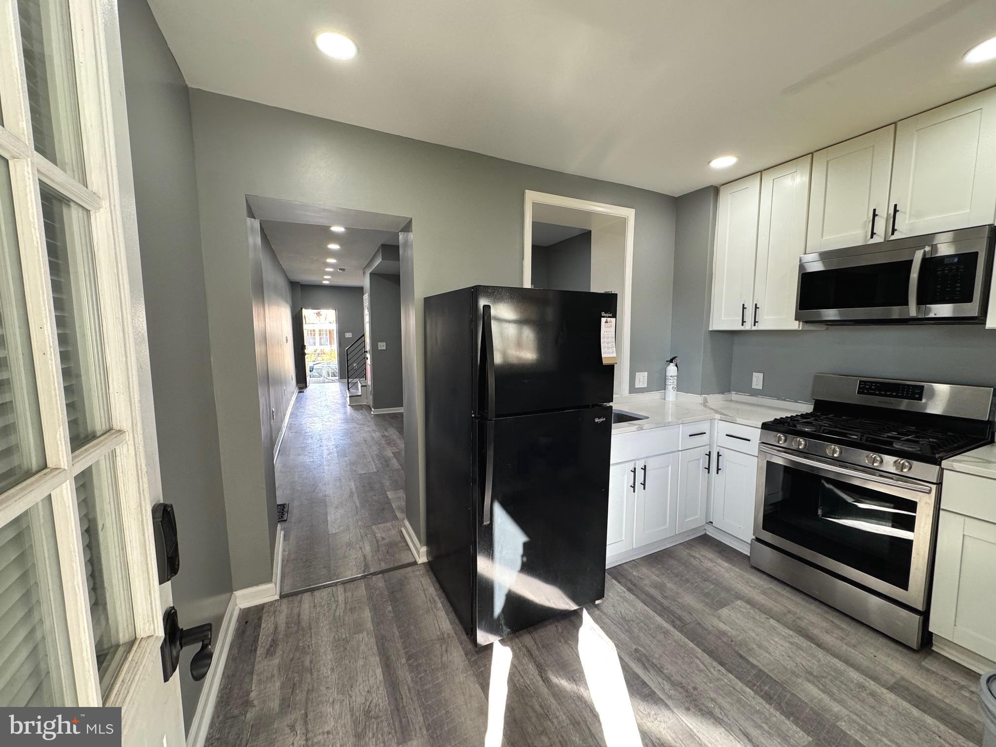 764 Morton Street Northwest Washington, DC 20010 - Photo 19 of 23 a kitchen with a refrigerator stove and microwave
