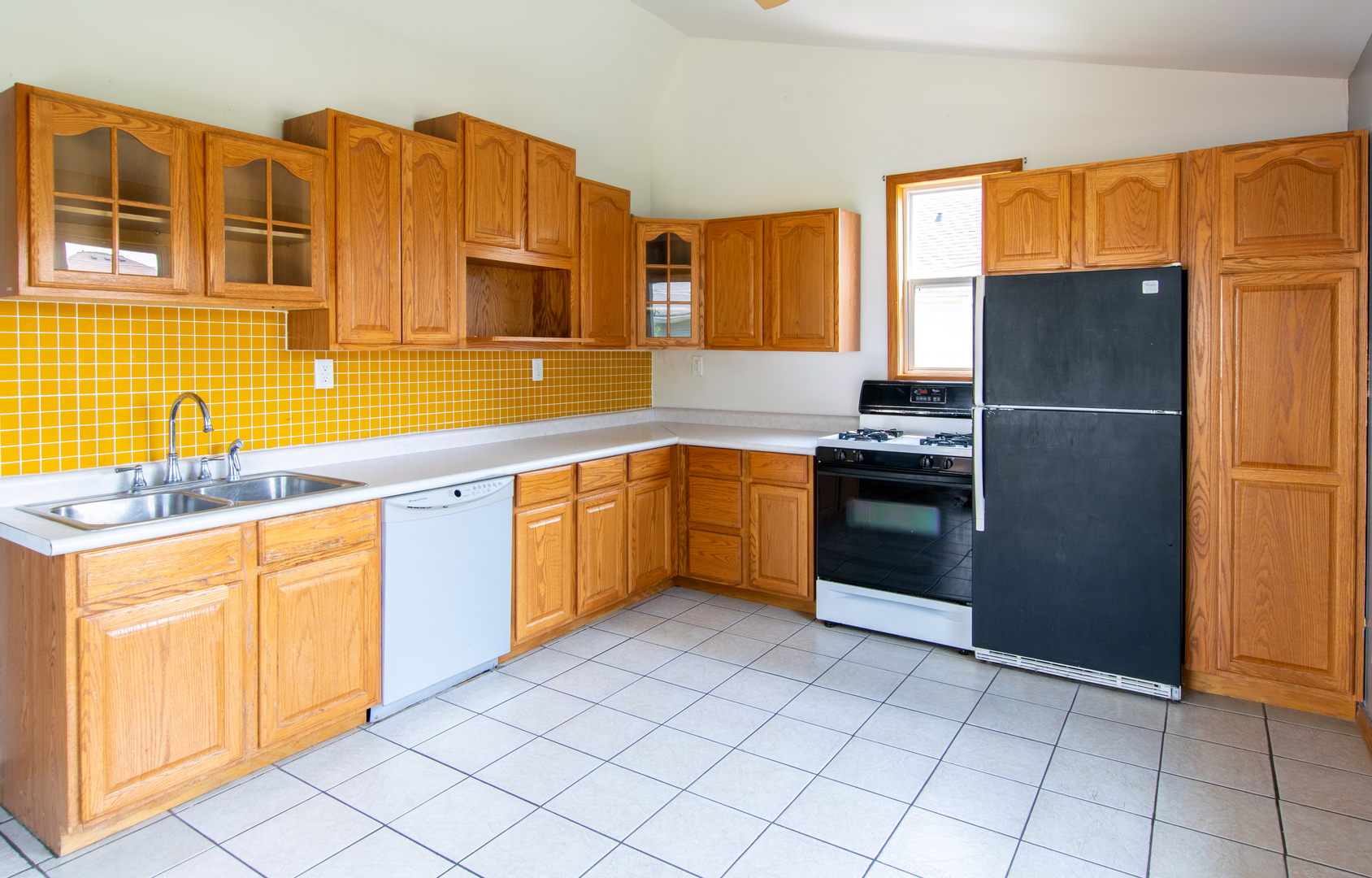 116 South 10th Street Rochelle, IL 61068 - Photo 3 of 19 a kitchen with stainless steel appliances granite countertop a sink stove and refrigerator