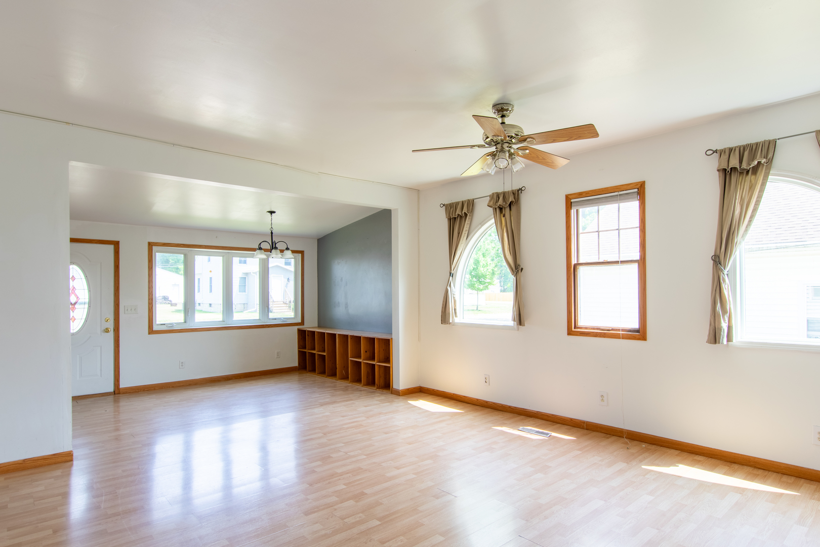 116 South 10th Street Rochelle, IL 61068 - Photo 6 of 19 an empty room with chandelier fan and windows