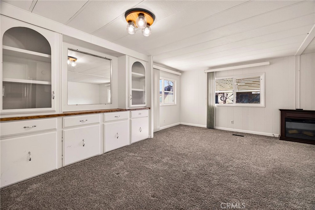 701 East Lassen Avenue, Unit 173 Chico, CA 95973 - Photo 12 of 49 an empty room with windows