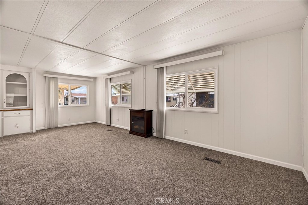 701 East Lassen Avenue, Unit 173 Chico, CA 95973 - Photo 3 of 49 an empty room with windows and cabinet