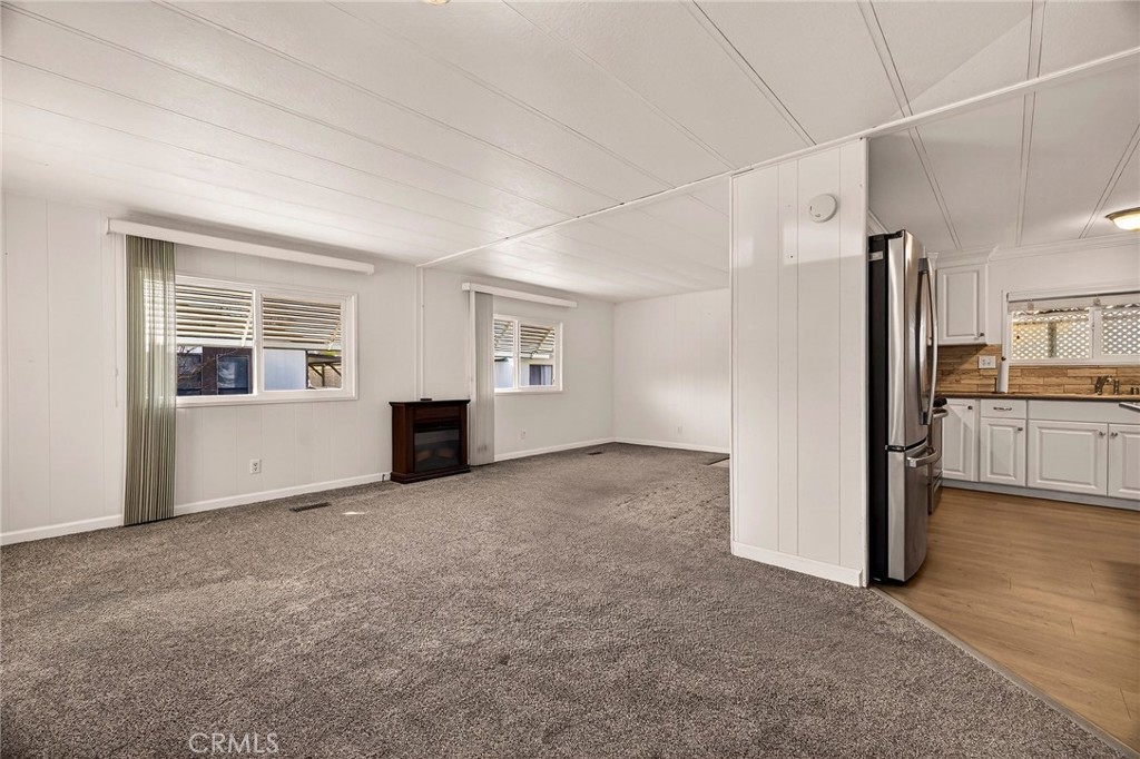 701 East Lassen Avenue, Unit 173 Chico, CA 95973 - Photo 5 of 49 a view of a kitchen with refrigerator and windows