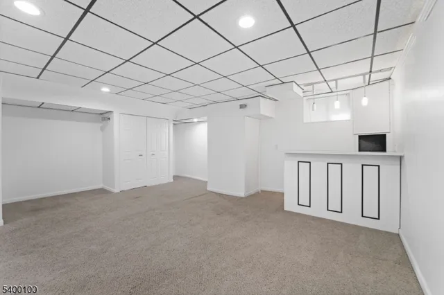 a balcony with wooden floor and fence