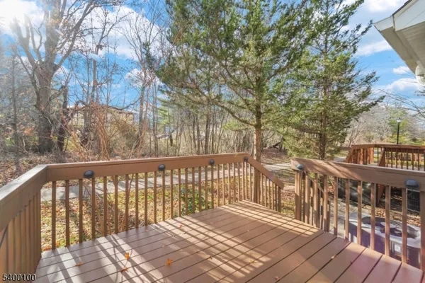 a view of a balcony with wooden floor