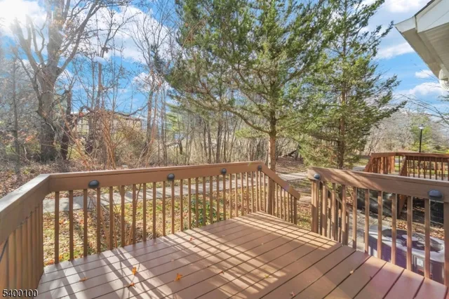 a view of a balcony with wooden floor