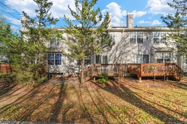 an aerial view of a house with a lake view