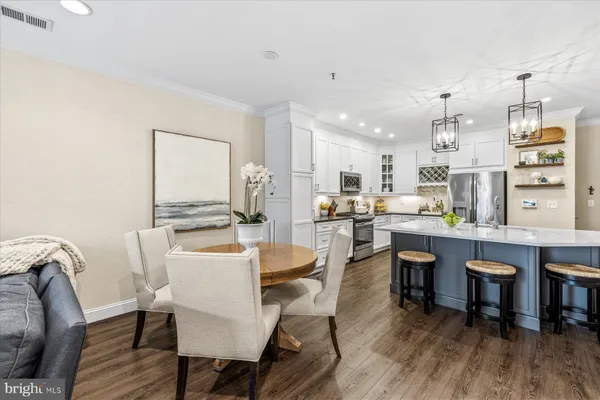 a view of a dining room with furniture and wooden floor