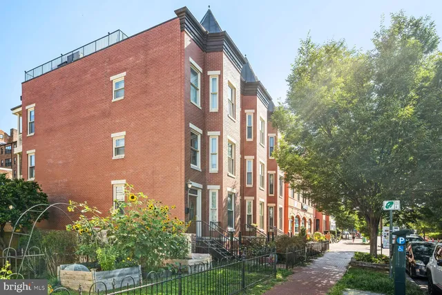 a front view of a building with garden