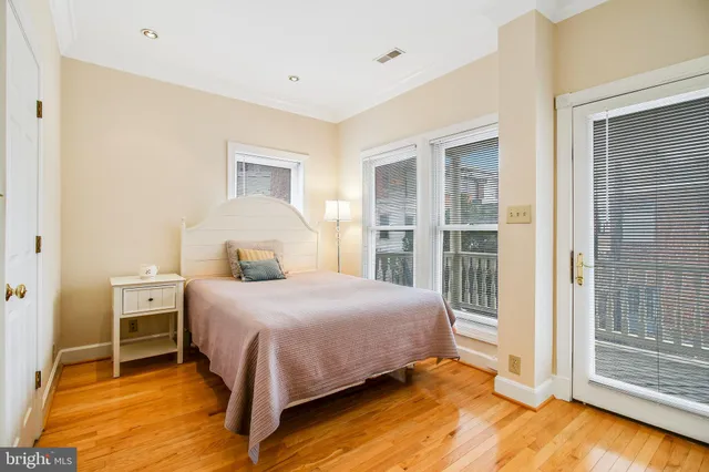 a bathroom with a sink mirror and toilet