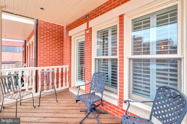 a view of roof deck with two lounge chairs