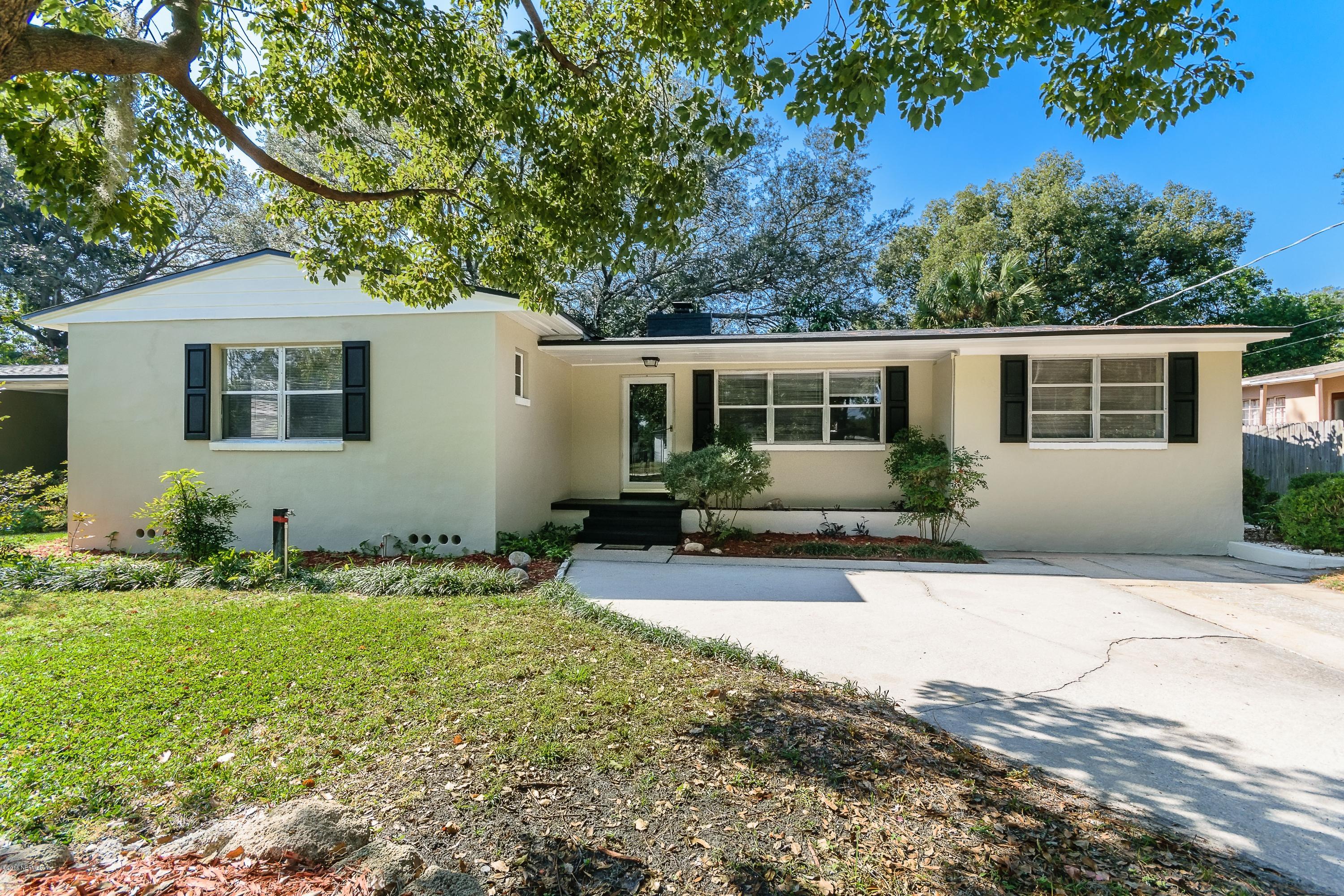 6330 Wesleyan Road Jacksonville, FL 32217 - Photo 1 of 17 a front view of a house with a yard