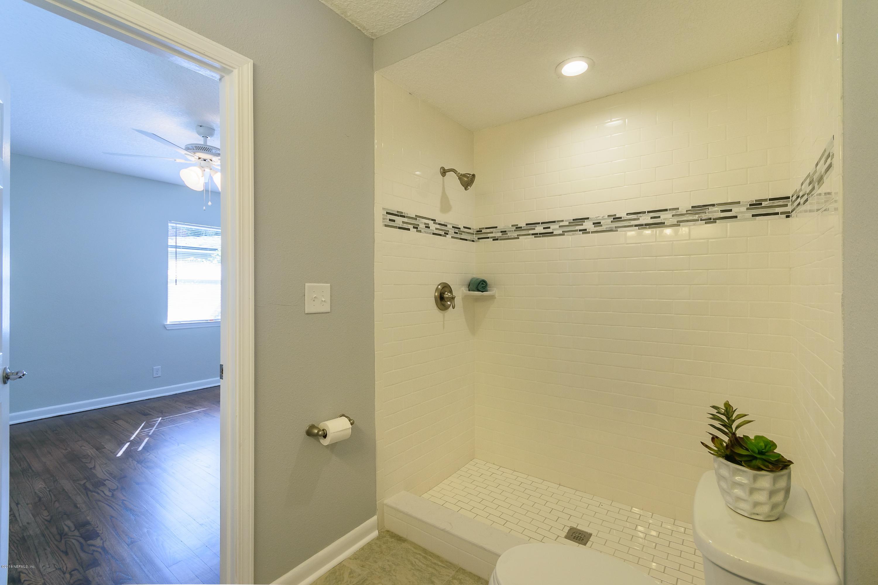 6330 Wesleyan Road Jacksonville, FL 32217 - Photo 12 of 17 a bathroom with a shower and a sink