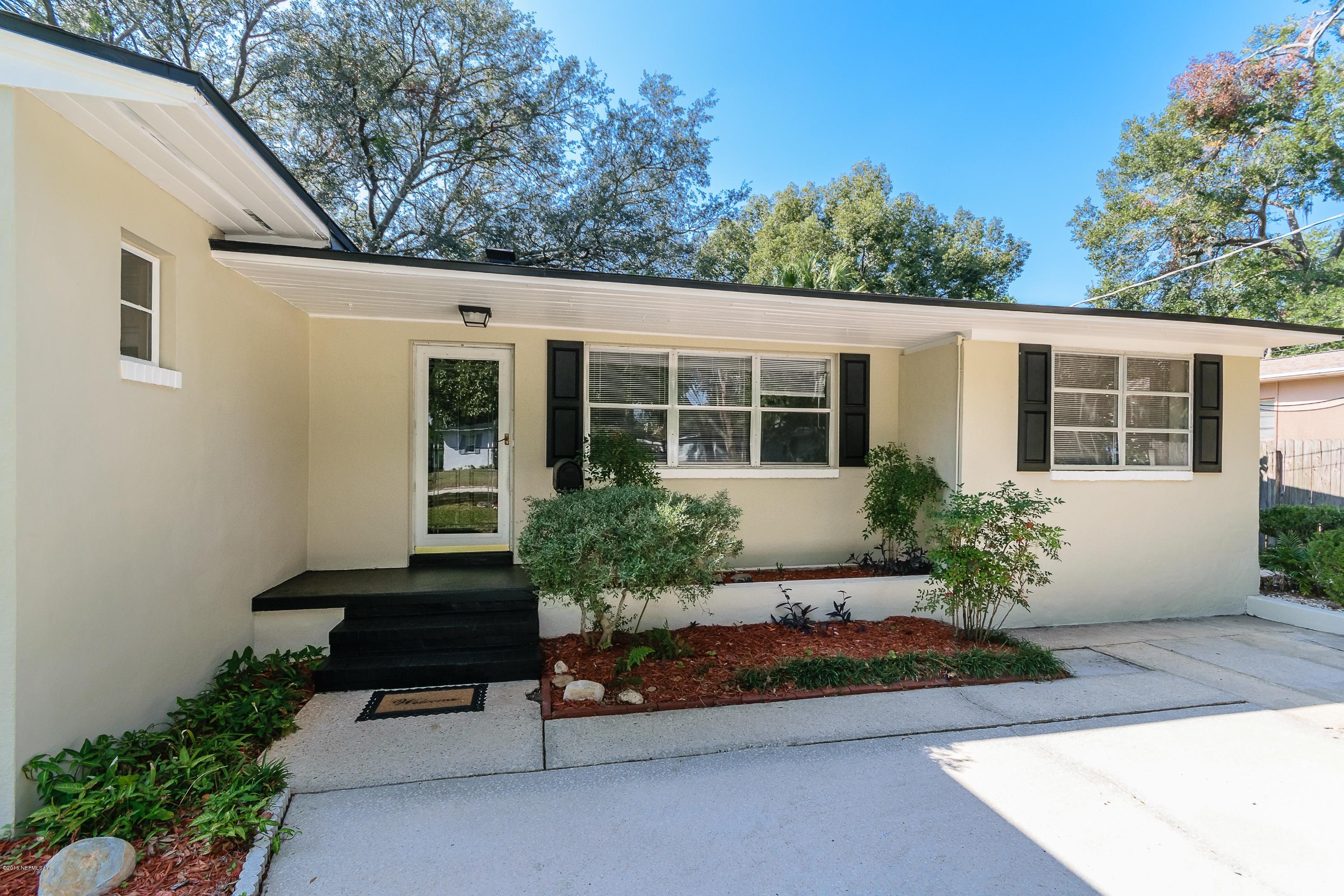 6330 Wesleyan Road Jacksonville, FL 32217 - Photo 3 of 17 a front view of a house with a yard