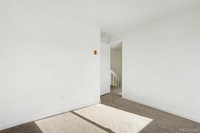 a view of a hallway with washer and dryer