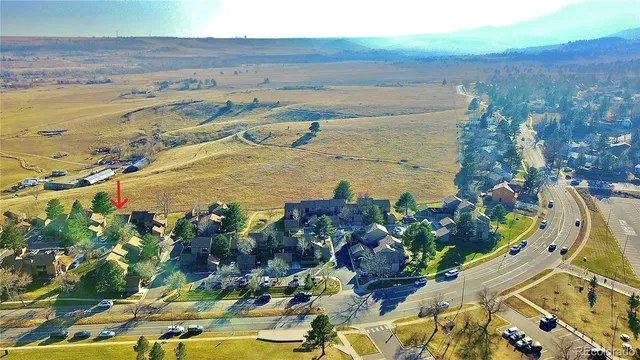 a view of a swimming pool with a table and chairs