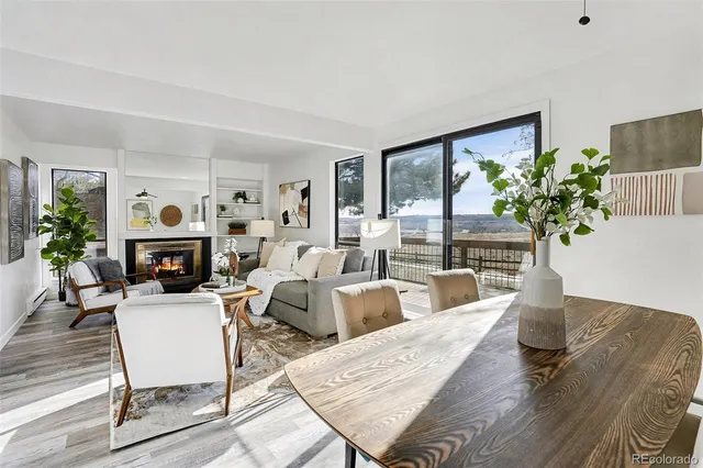 a dining room with furniture and wooden floor