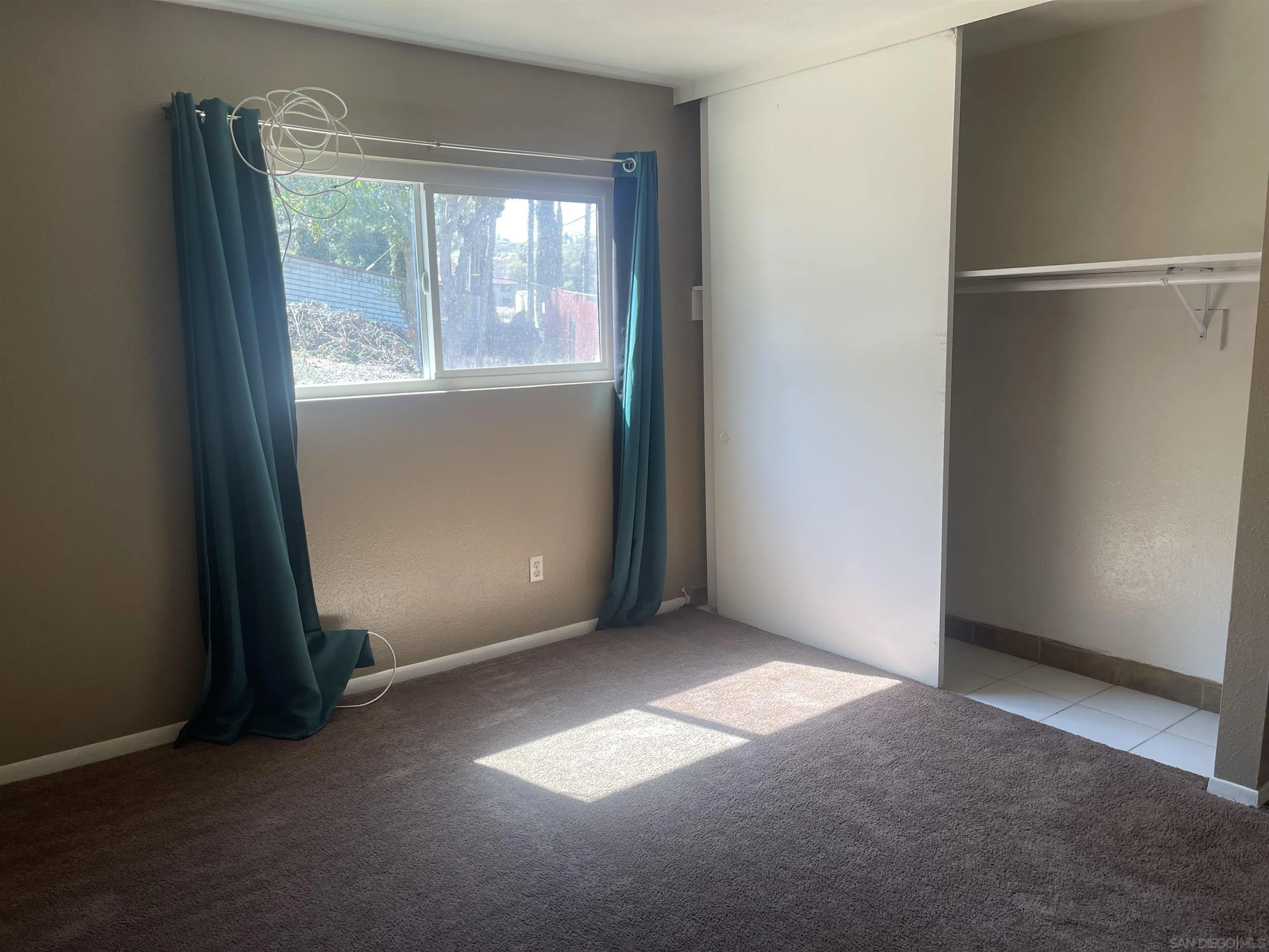 2248 La Cresta Road El Cajon, CA 92021 - Photo 4 of 11 an empty room with windows