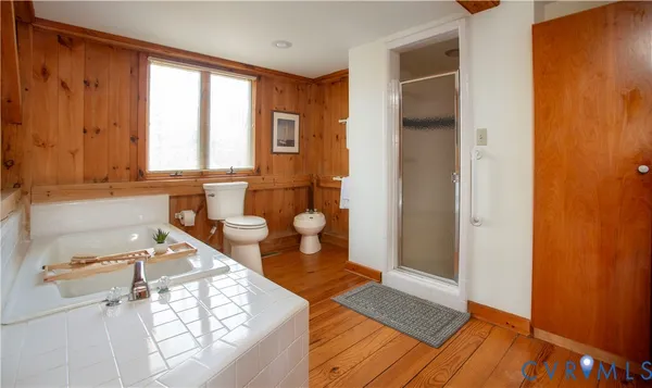 a view of a kitchen with wooden floor and a sink