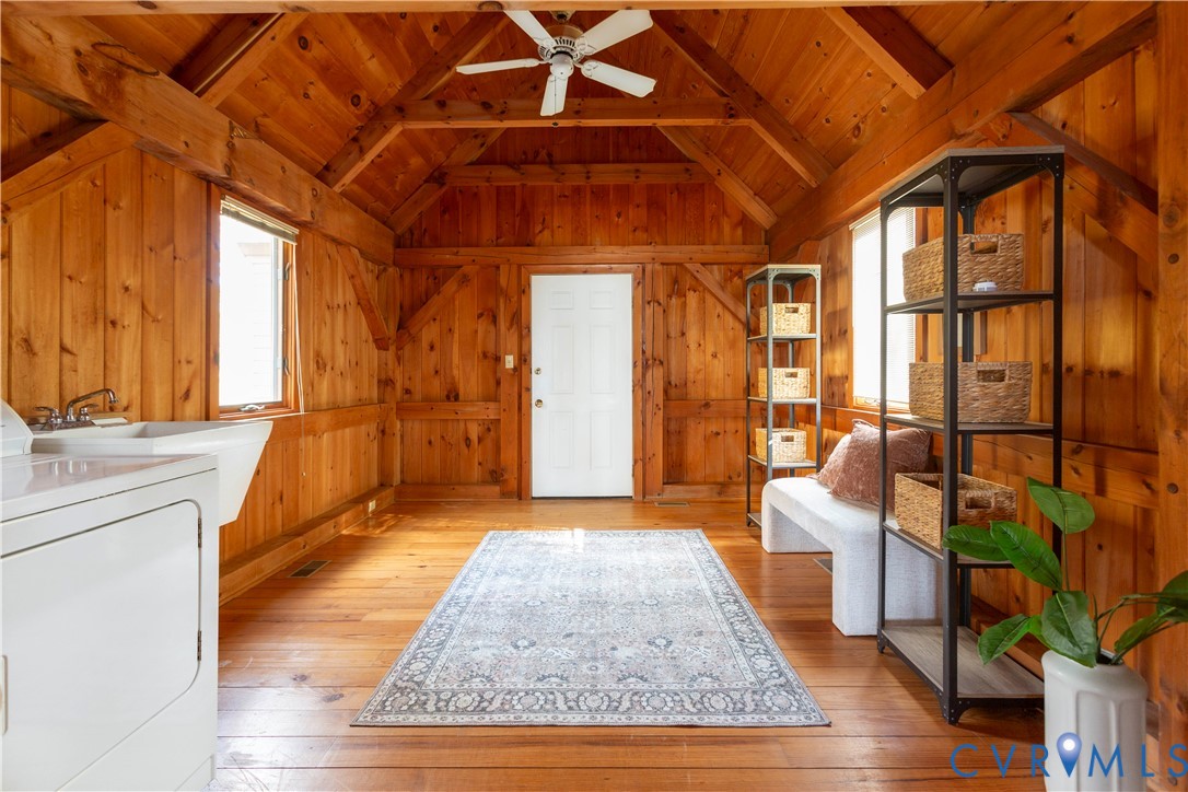 877 Twiggs Ferry Road Hartfield, VA 23071 - Photo 22 of 34 a view of an entryway with wooden floor and couches