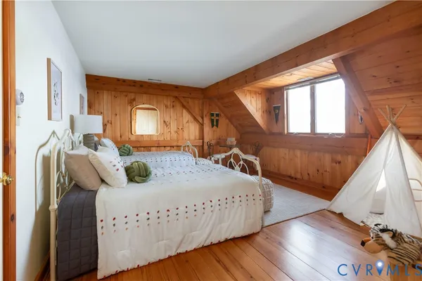 a bedroom with bed and window