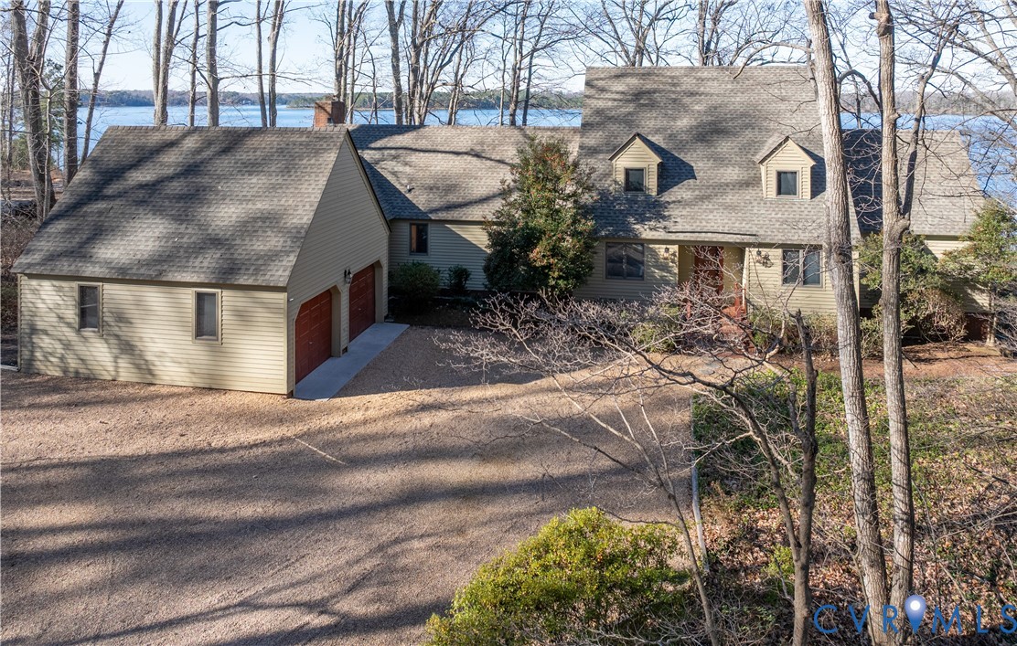 877 Twiggs Ferry Road Hartfield, VA 23071 - Photo 33 of 34 a front view of a house with a yard