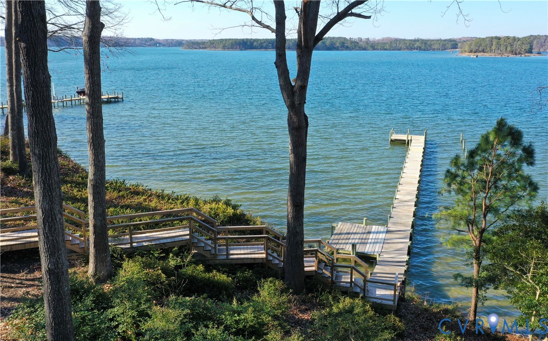 877 Twiggs Ferry Road Hartfield, VA 23071 - Photo 4 of 34 a view of a balcony with chairs