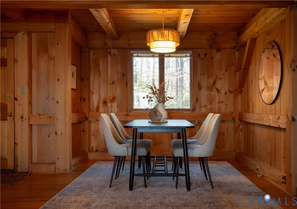 a dining room with furniture and window
