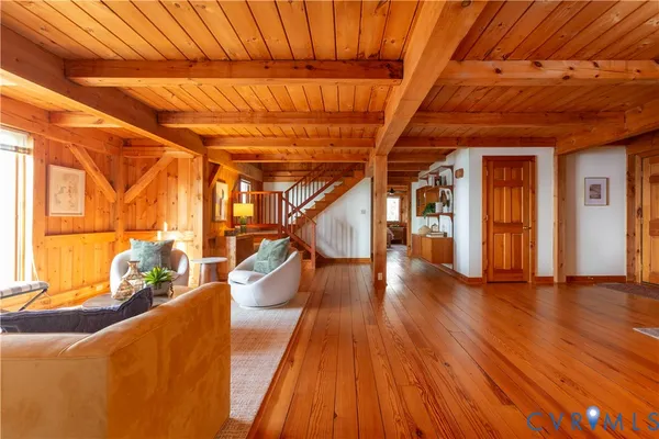 a view of a room with wooden floor