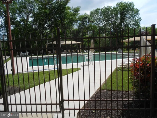 a view of a patio with a dining table and chairs