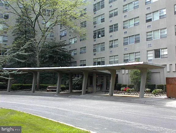 a view of backyard with swimming pool and seating