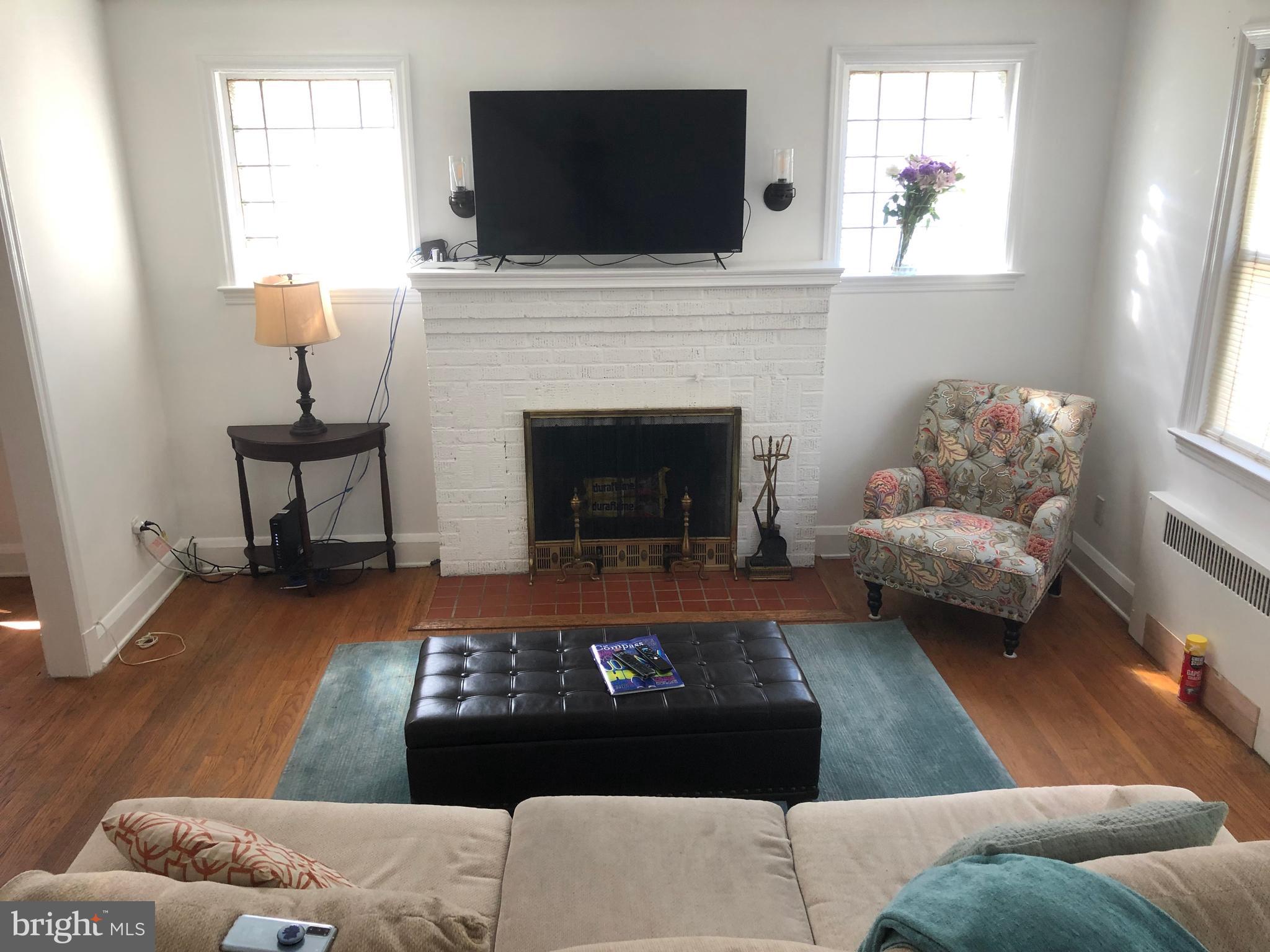 5105 Edgar Terrace Baltimore, MD 21214 - Photo 9 of 63 Glass block windows straddle the fireplace