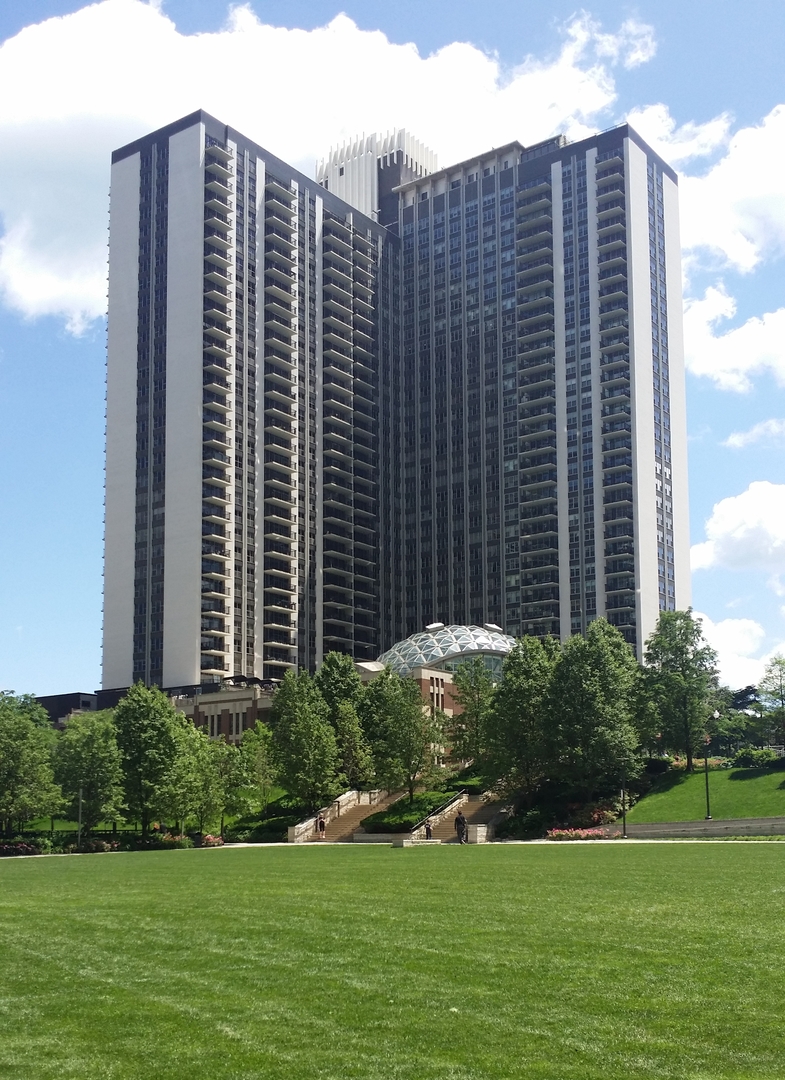 400 East Randolph Street, Unit 2302 Chicago, IL 60601 - Photo 1 of 22 a view of a building with a garden