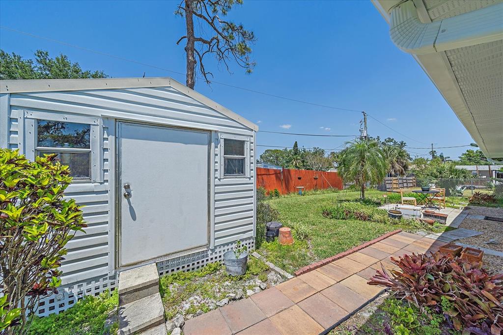 880 Horizon Road Venice, FL 34293 - Photo 8 of 39 shed has stores the hurricane shutters