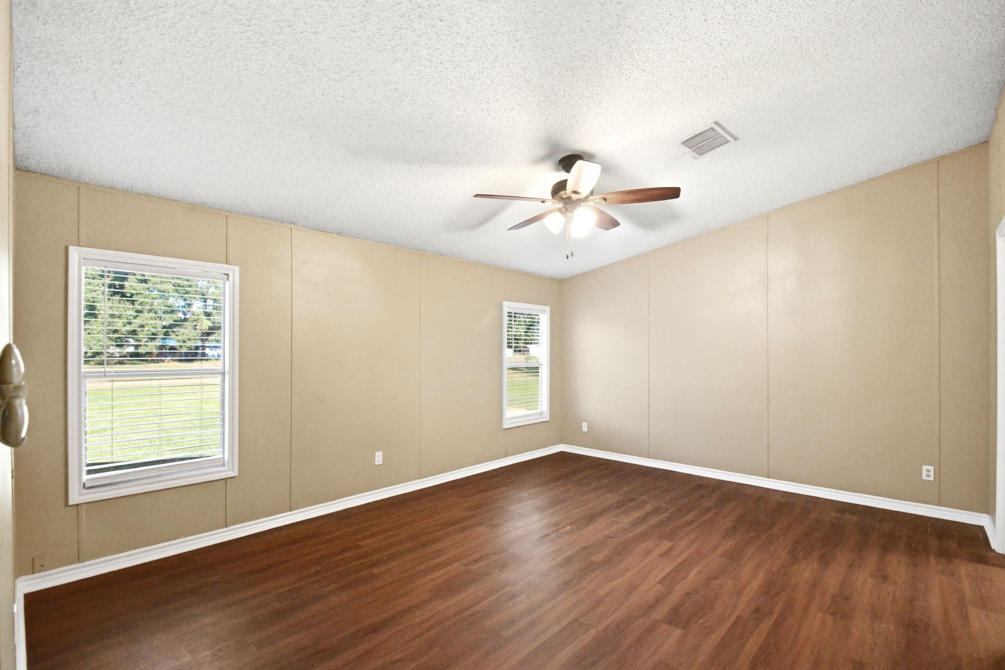 290 Monticello Street Trinity, TX 75862 - Photo 14 of 36 Spacious Primary Bedroom with Natural Light