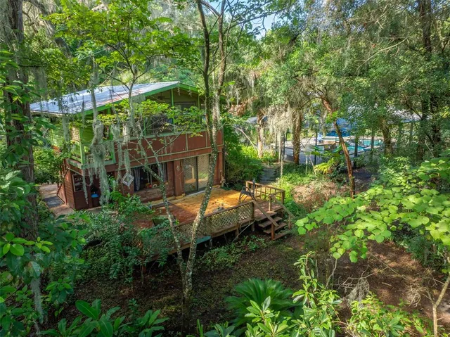 a view of yard with green space and seating area