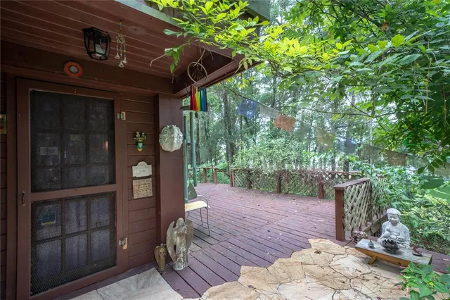 a view of a house with a tree