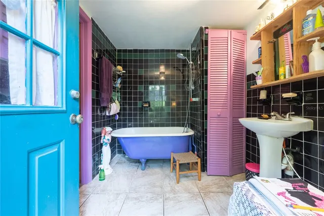 a backyard of a house with lots of green space and glass windows