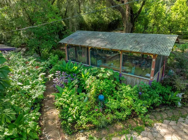 a bathroom with a granite countertop sink and a shower