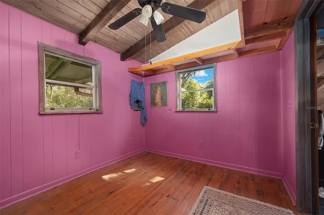 a bathroom with a tub sink shower and mirror