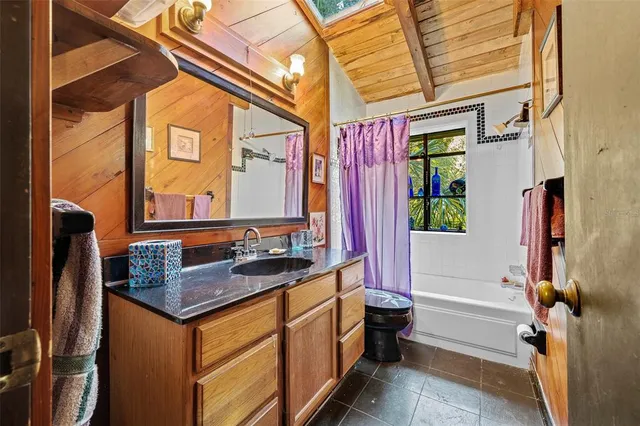 a sitting area with furniture and wooden deck