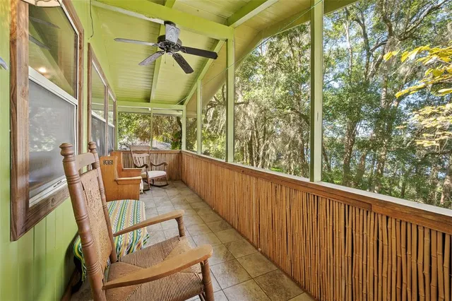a view of a kitchen with a large window
