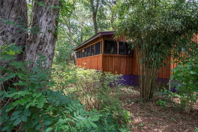 a view of a house with a tree