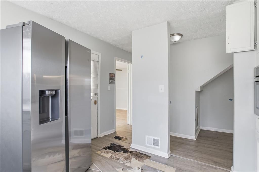 720 Twin Pines Road Covington, GA 30014 - Photo 19 of 40 a view of livingroom with furniture and wooden floor