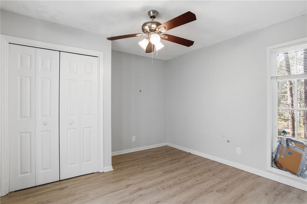 720 Twin Pines Road Covington, GA 30014 - Photo 23 of 40 wooden floor in an empty room with a window