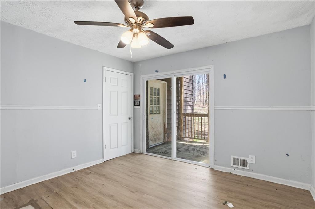 720 Twin Pines Road Covington, GA 30014 - Photo 28 of 40 wooden floor in an empty room with a window