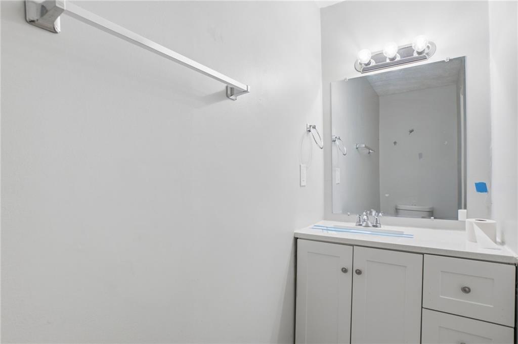 720 Twin Pines Road Covington, GA 30014 - Photo 34 of 40 a bathroom with a sink and a mirror