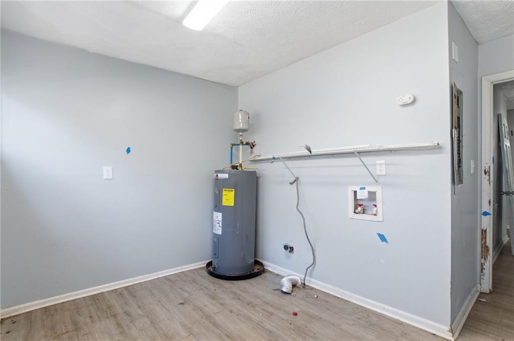 720 Twin Pines Road Covington, GA 30014 - Photo 35 of 40 a view of water heater room with empty space