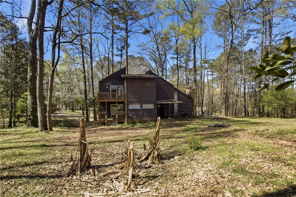 720 Twin Pines Road Covington, GA 30014 - Photo 39 of 40 a view of a house with a yard